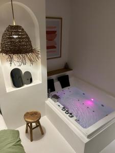 Appartements Bali Suite - Spa Jacuzzi : photos des chambres