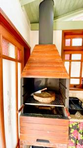 Casa próximo da praia do Perequê com garagem, churrasqueira e ar condicionado