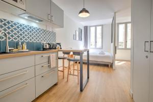 Appartements Apparts Limogeanne - Clim - Centre historique : photos des chambres