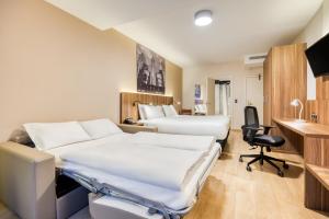 King Suite with Sofa Bed room in Holiday Inn Brussels Schuman an IHG Hotel