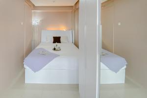 Homey 1BR Apartment @ Bassura City By Travelio