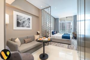 Vogue DAMAC Maison Prive Balcony & Pool with Canal View Prime Business Bay Location, Steps from Downtown & Burj Khalifa