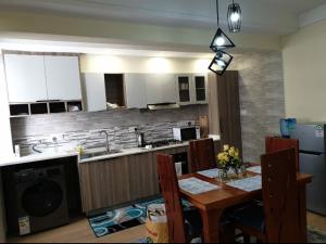 serenity suites apartment with private parking space,modern equipped gym,heated swimming pool and a relaxing rooftop with unbeatable city views