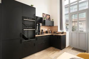 Appartements L-Eden d-Elyse - Duplex premium- parking gratuit : photos des chambres