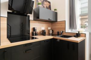 Appartements L-Eden d-Elyse - Duplex premium- parking gratuit : photos des chambres