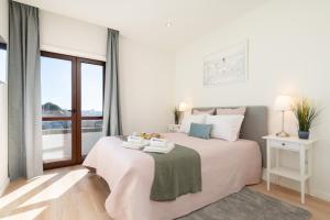 Bright & Spacious Retreat with Balcony by HostWise