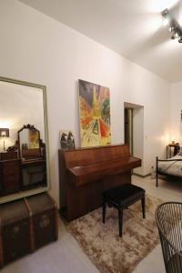 Appartements La Tour des Songes Place Dampmartin Uzes : photos des chambres