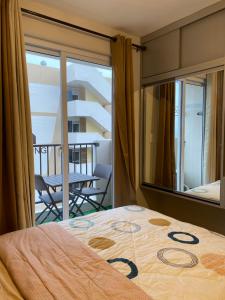 Studio with Balcony and Pool View in the Heart of Lapu-Lapu, Cebu