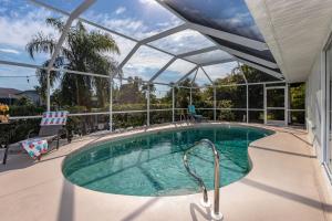 Villa Christylee - Gulf-access electric-heated salt water pool home wpool table - SWFL Rentals