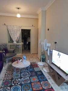 2 bedrooms apartment fully furnished air conditioned with great view and privet garden at degla palms compound located at 6 October city