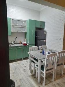 2 bedrooms apartment fully furnished air conditioned with great view and privet garden at degla palms compound located at 6 October city