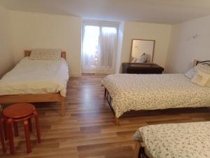 Appartements Au Coin Maison : photos des chambres