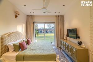 StayVista at Meadow Muse with Outdoor Pool - Manesar