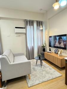 The Nialls Suites at HOPE Residences besides SM TRECE