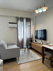 The Nialls Suites at HOPE Residences besides SM TRECE