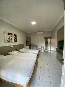 Flat Incrível Amarilis dentro da Riviera São Lourenço - Estúdio exclusivo, enxoval, wifi e serviço de praia