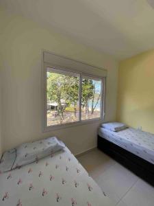 Casa Pé na Areia Boiçucanga