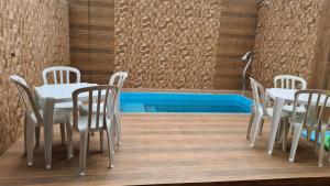 Casa com piscina 5 minutos Á PÉ do mar ,ar condicionado, smart tv praia Martim de Sá