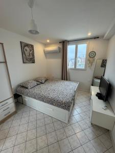 Appartements Studio cosy Paris La Defense Arena : photos des chambres