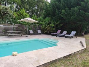 Maisons de vacances Maison au calme sur grand terrain avec piscine : photos des chambres