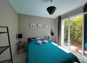 Maisons de vacances Maison lumineuse avec jardin : photos des chambres