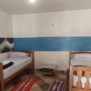 Quarto compartilhado com ar condicionado banheiro externo compartilhado