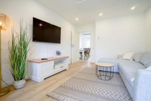 Sonnenterrasse - Helle & moderne Ferienwohnung am Meer