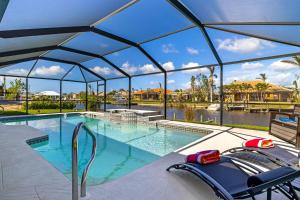 Villa Sunny - Fully remodeled pet friendly electric-heated pool home on Gulf-access canal - SWFL Rentals