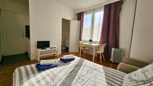 Appartements Studio Alba - 15min Paris RER E, cosy : photos des chambres