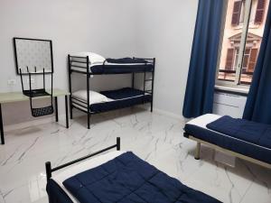 Bed in 4-Bed Mixed Dormitory Room room in Palladini Hostel Rome