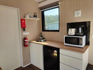 Tiny Retreat by the River by Tiny Away