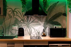 Appartements L'Oasis Tropicale, Jacuzzi, Love Room : photos des chambres