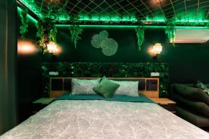 Appartements L'Oasis Tropicale, Jacuzzi, Love Room : photos des chambres