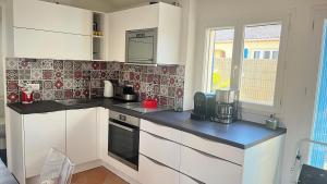 Maisons de vacances La maison aux volets bleus : photos des chambres