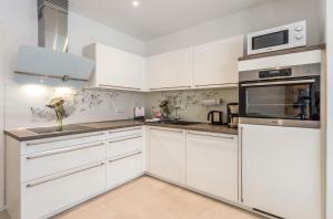 Pusteblume - Barrierefreie 5-Sterne-Ferienwohnung mit Seeblick und Sauna