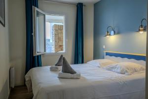 Appartements Ti Cap - plage a pieds - Piscine : photos des chambres