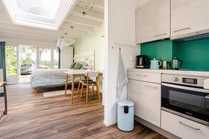 Light tiny house in green area with sauna option