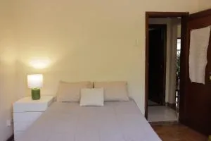 Quarto Casal com Varanda Casa Caramel - Raposos
