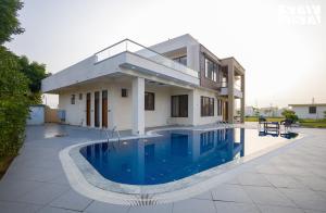 StayVista at Lush Haven with Pool, AC