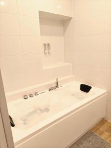 Appartements Zen lodge jacuzzi prive : photos des chambres
