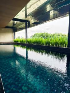 Apt Kemang Village Tower Intercon with Wi-Fi and Pool by Damaresa