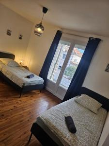 Appartements Le Jean Zay climatisaion parking prive : photos des chambres