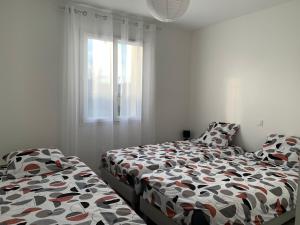 Maisons de vacances Gite neuf, a 12mn du Futuroscope, a la campagne -Le Trefle : photos des chambres