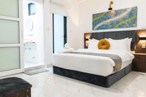 Aina Residency Beachfront Hotel