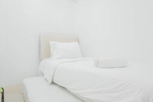 Elegant 2BR at Bassura City Apartment By Travelio