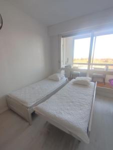 Appartements Appartement vue sur mer & le port de Courseulles-sur-Mer : photos des chambres