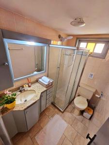 Refúgio na Praia Grande com Ar-Condicionado