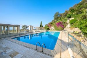 Appartements Les Miradors, charmant appartement de 2 chambres en RDC, jardin privatif, piscine, vue mer et parking : photos des chambres