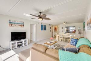 Coastal Condo Escape with Patio Steps to Beach