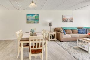 Coastal Condo Escape with Patio Steps to Beach